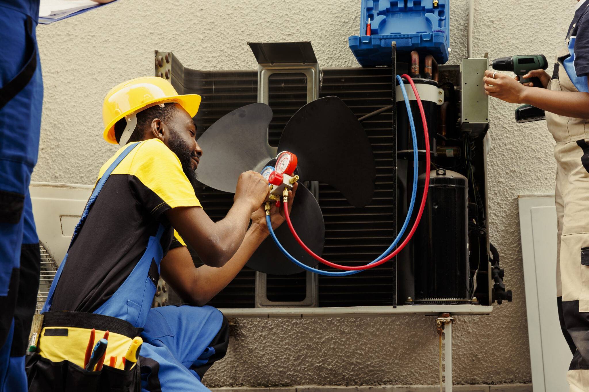 worker refilling hvac system refrigerant 2048x1365